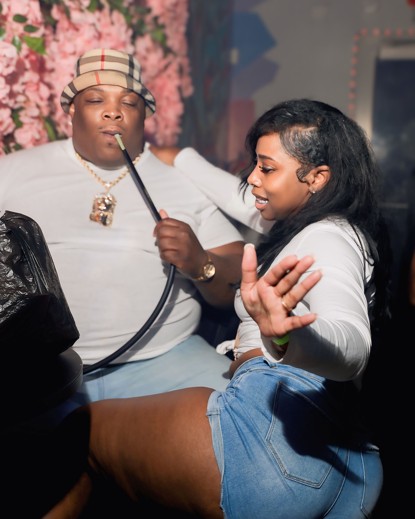 Couple sharing hookah experience
